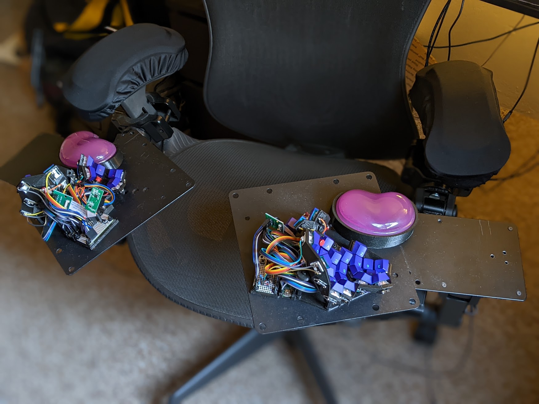 Facing the chair, keyboard and wrist rests magnetically attached to mount